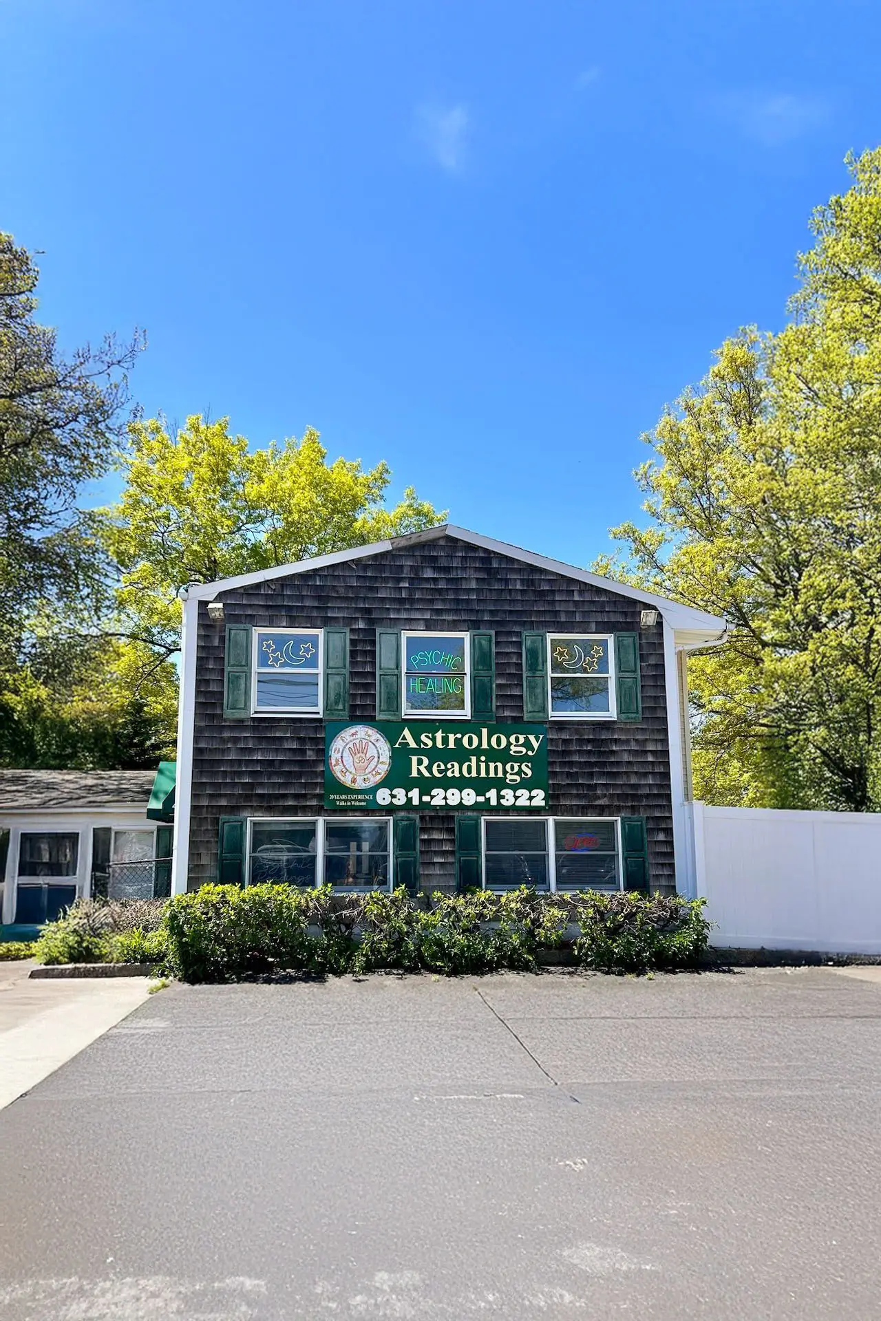 Exterior of two story business Psychic Advisor Love Specialist.